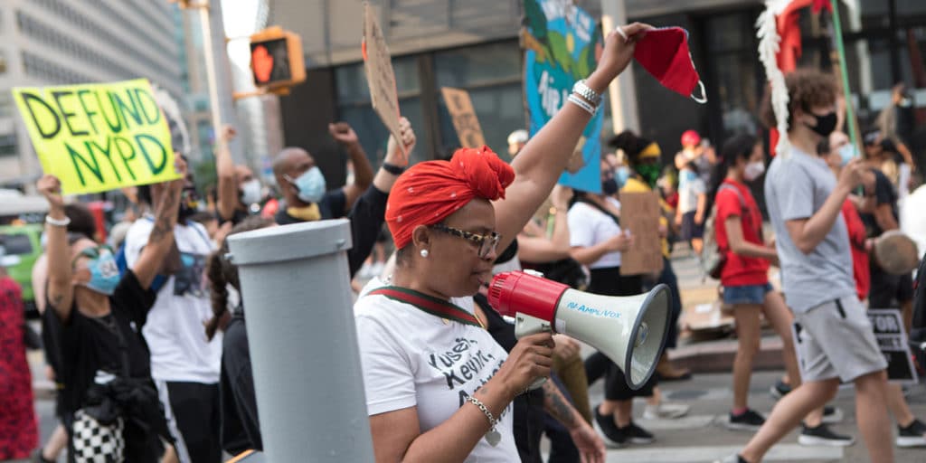 People marching with signs against police violence
